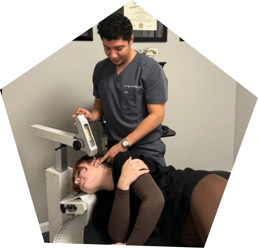 Chiropractor using the Orthogonal Technique to relieve pain.
