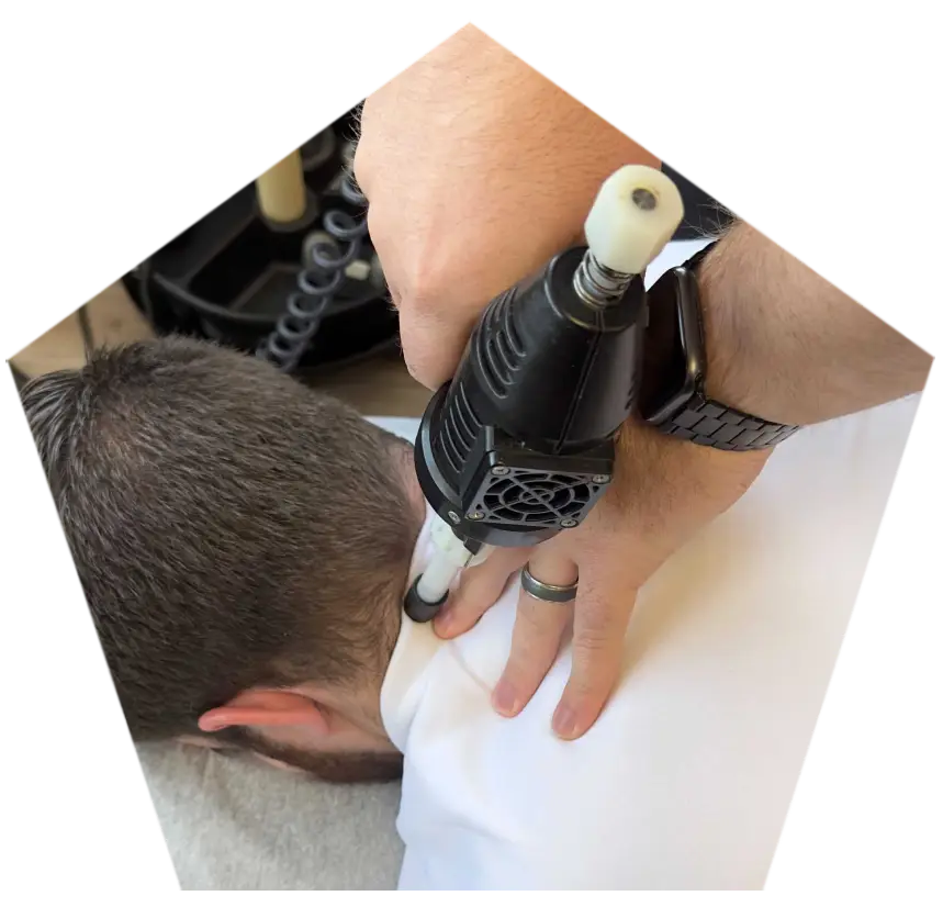A patient receiving specialized care from a migraine relief chiropractor.